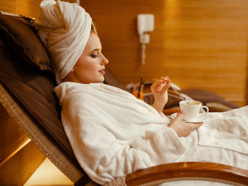 sexy-girl-relaxing-with-cup-of-coffee-in-spa-chair-RG4FKYD.jpg